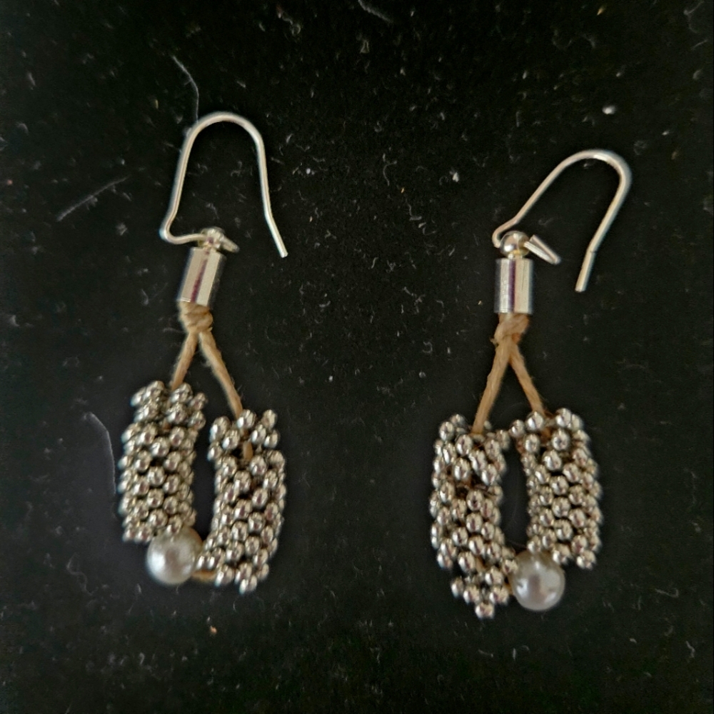 Pretty statement earrings with silver and pearl accents for pierced ears.